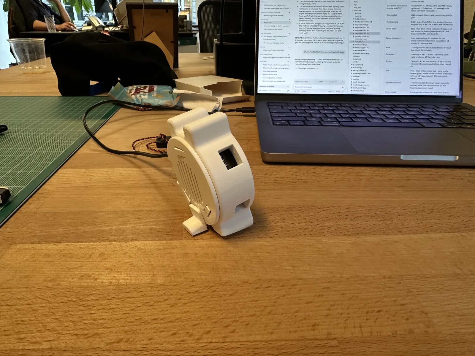 Rear view of the assembled white enclosure, showing the vented back and small support foot